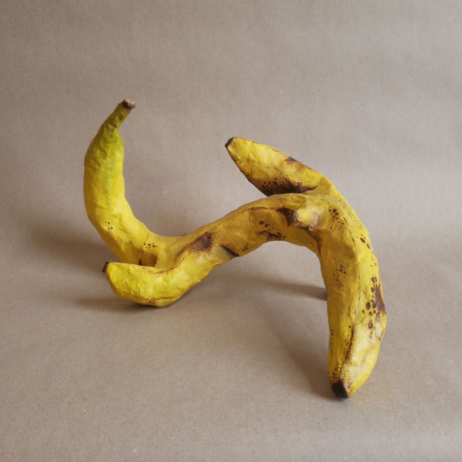 Wavy Banana | 18x12x10in, papier mache sculpture with acrylic paint, 2025.